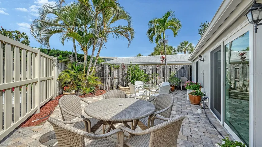 Sunny open air patio provides plenty of space for entertaining and al fresco dining.