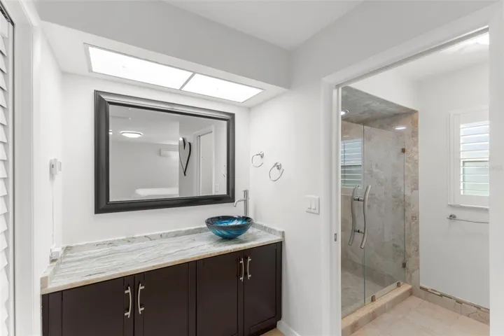 MASTER BATHROOM WITH WALK IN SHOWER, TOILET AND WALK IN CLOSET