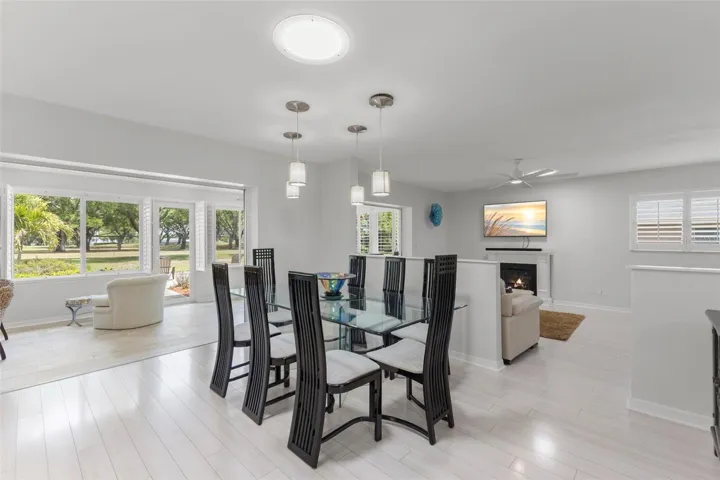 FROM LIVING ROOM VIEWING THE 6TH FAIRWAY THRU THE FRONT, BACK PORCH, FAMILY ROOM AND DINING ROOM