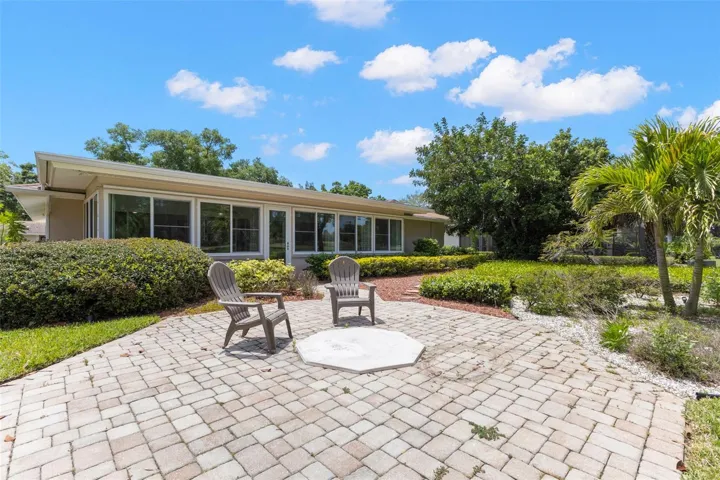 VIEW OF BACK OF PROPERTY WITH LOTS OF LIGHTS AND SHUTTERS FOR PRIVACY - GENERAC INCLUDED