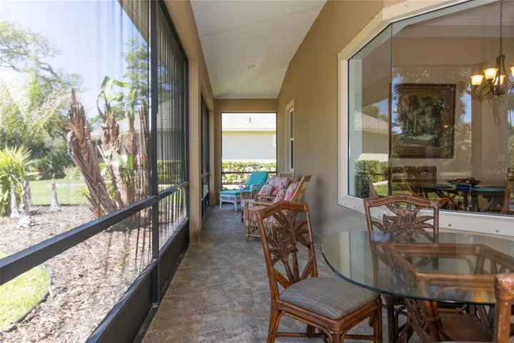 Covered lanai view overlooking eat-in kitchen