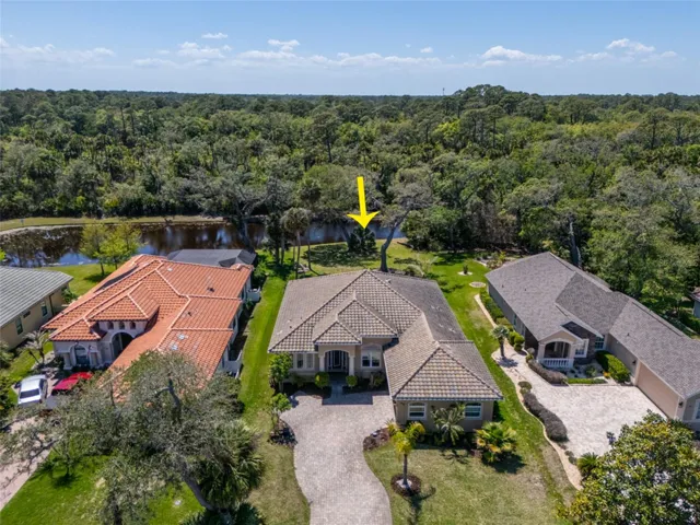 Ariel view of home with pond