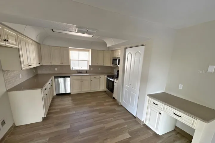 kitchen has closet pantry as well as built in desk