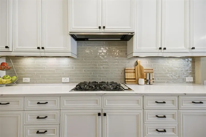 Fresh new backsplash and quartz counters.