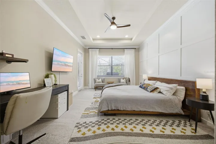 Main floor primary suite with private door to pool area.