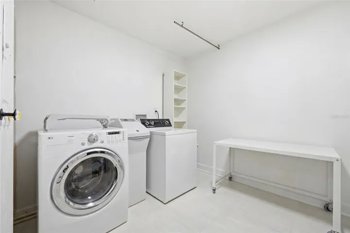 WOW! Very spacious utility/laundry/storage off the kitchen