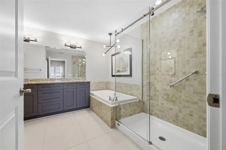 Primary bath features new shower enclosure