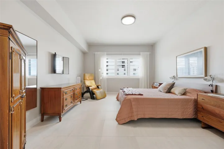 Primary bedroom with plantation shutters