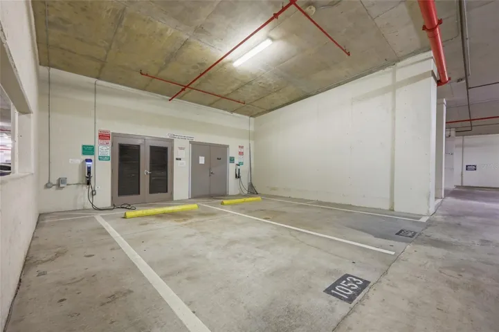 Entrance from garage to building & EV stations