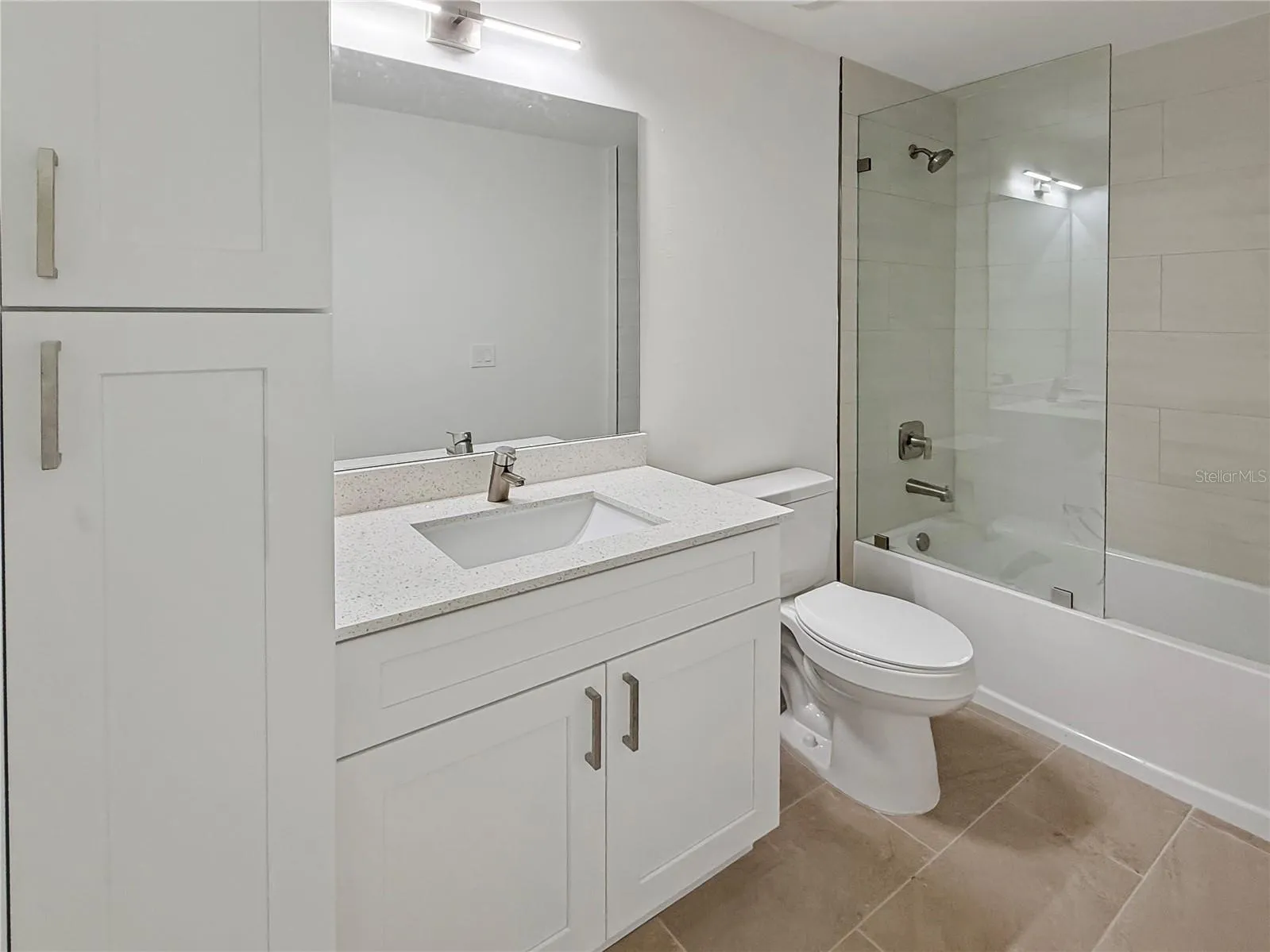 Bathroom 2 featuring tall linen cabinet