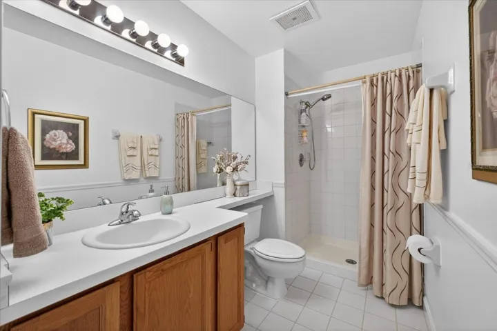 Guest bathroom upper level with linen closet.