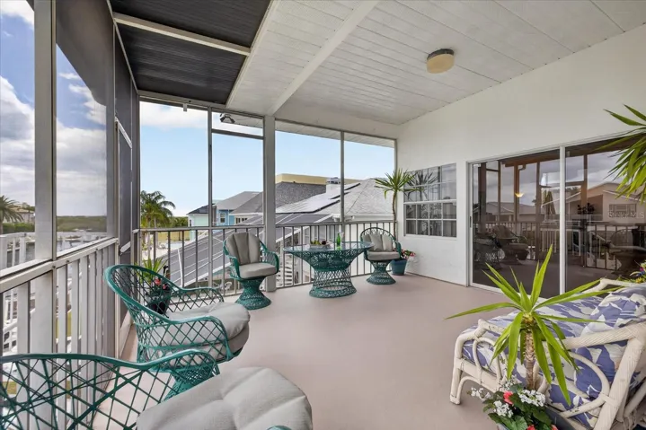 Upper waterfront balcony-screened