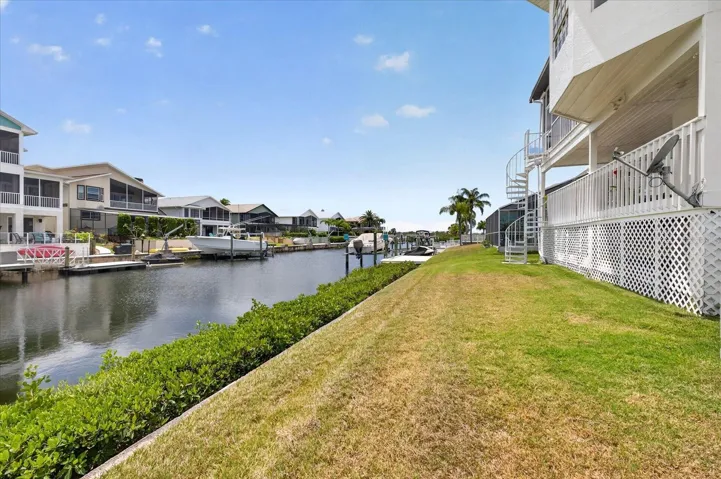 Backyard view looking west down channel towards Gulf