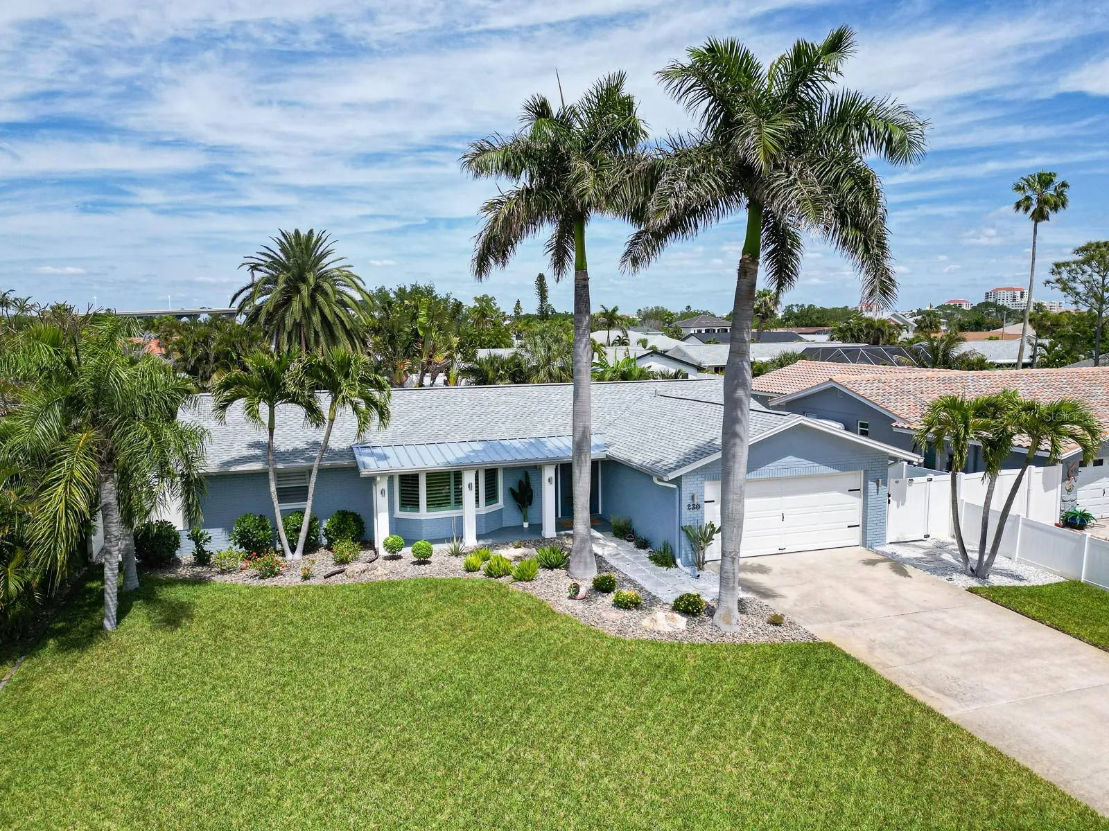Manicured curb appeal, pristine coastal home