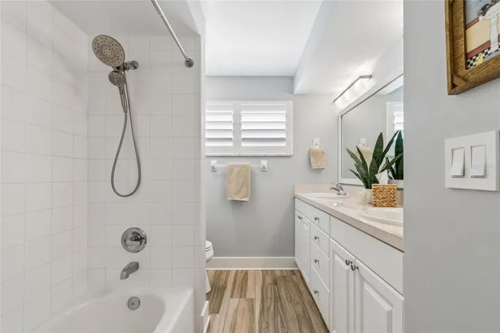 Guest bath, tub-shower, double sinks, natural light
