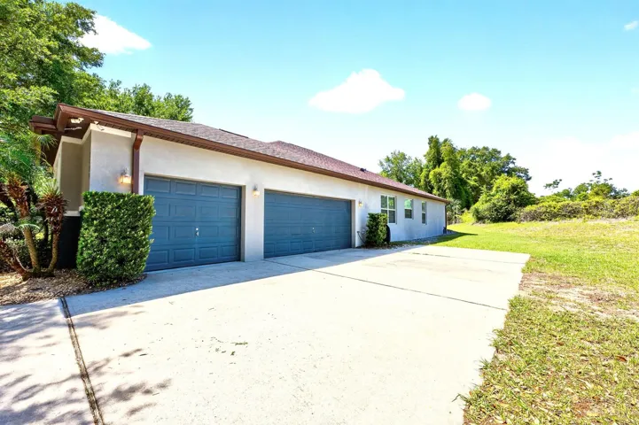 3-car side facing garage.