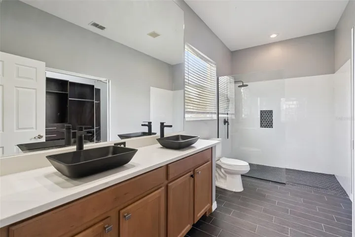 Primary Bath ADA accessible toilet and shower