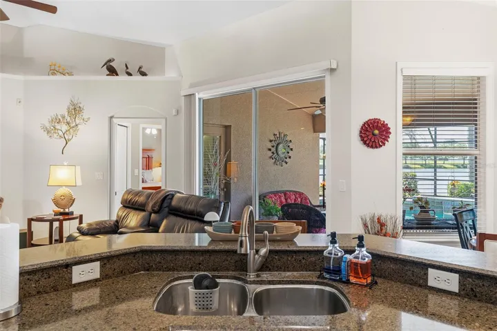 Sliding doors and a pool bath door lead to your outdoor oasis