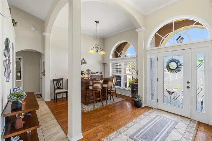 Striking lead-glassed door and soaring ceilings
