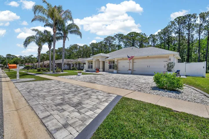 Front of house and sidewalk/paved driveway