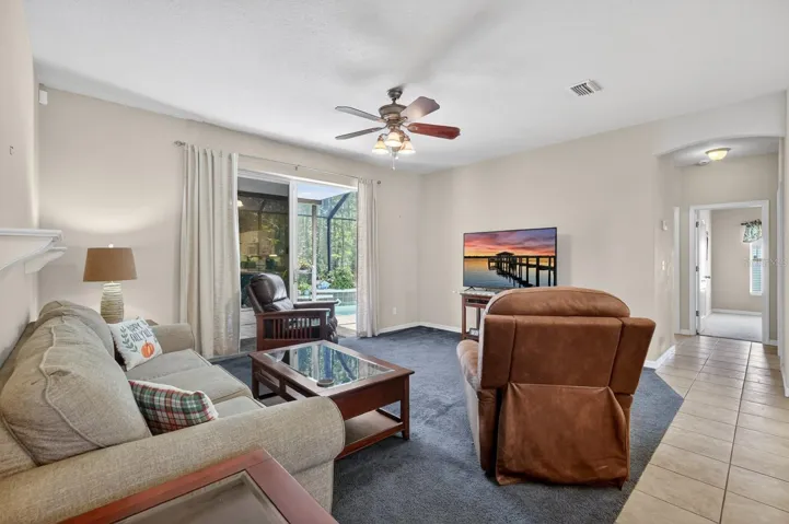 Living room facing lanai and pool