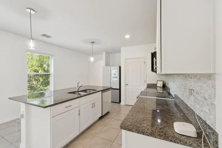 Sleek, modern kitchen with designer Samsung appliances!
