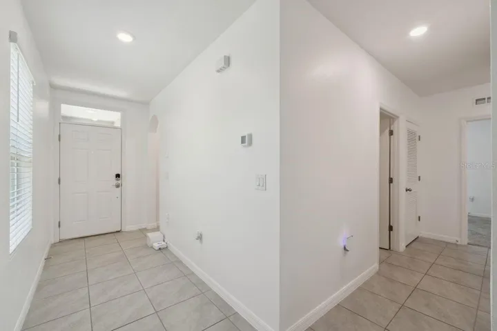 Entry foyer.  Great space for art or family gallery.