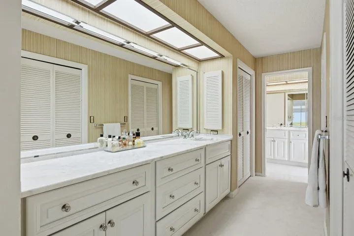 Primary Ensuite with dual vanities, linen closet and dual walk in closets.