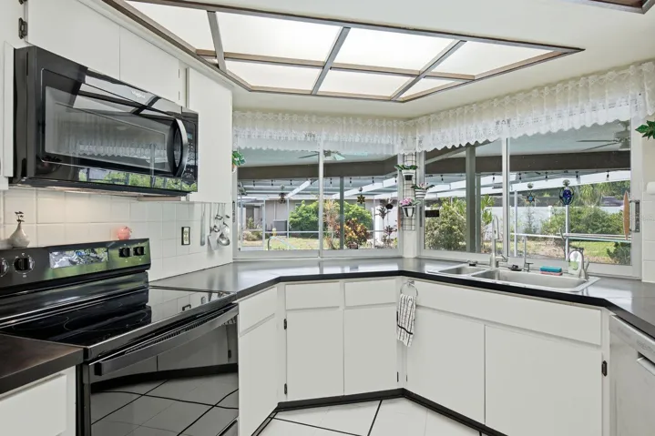 Kitchen with pass through windows to patio