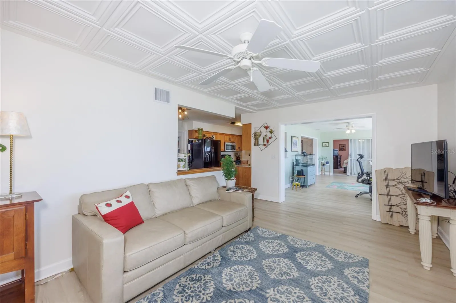 Great Room, Classic Elegance Coffered Ceiling &amp; Electric Fireplace, LVT Plank Flooring