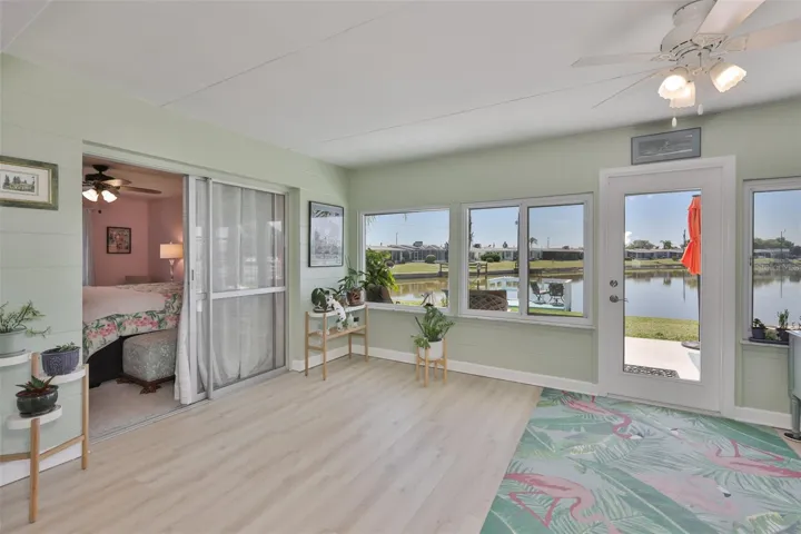 Enclosed Lanai, Modern LVT Plank Flooring, Newer Windows, Breathtaking South Lake View