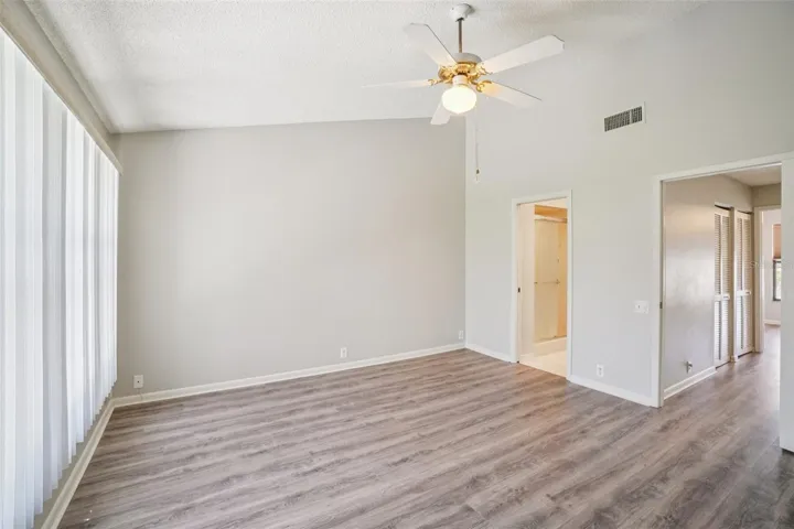 SPACIOUS PRIMARY BEDROOM OVERLOOKS BACK YARD