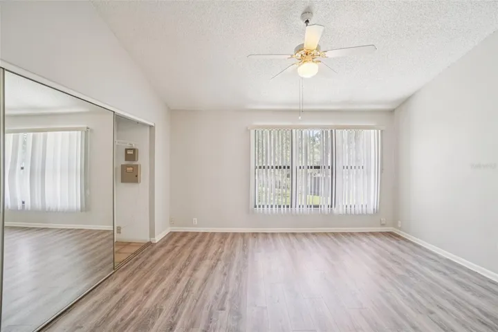 SPACIOUS PRIMARY BEDROOM OVERLOOKS BACK YARD