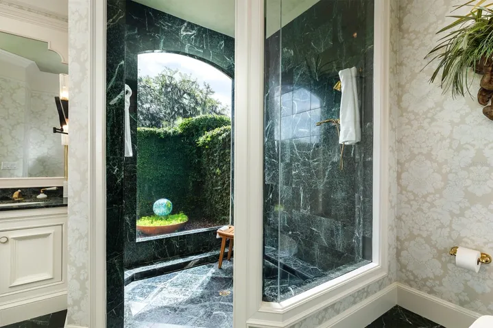 Such a serene space for showering with such an abundance of light peeking through.