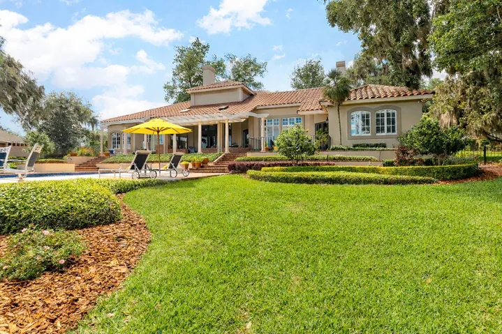 Experience your LAKESIDE LEGACY with 4-5 bedrooms, 5.5 baths pool home, three-car garage, porte-cochere, pool and spa, boathouse and dock, plus bonus flex space in the basement—ideal for a workout room or wine tasting cellar.