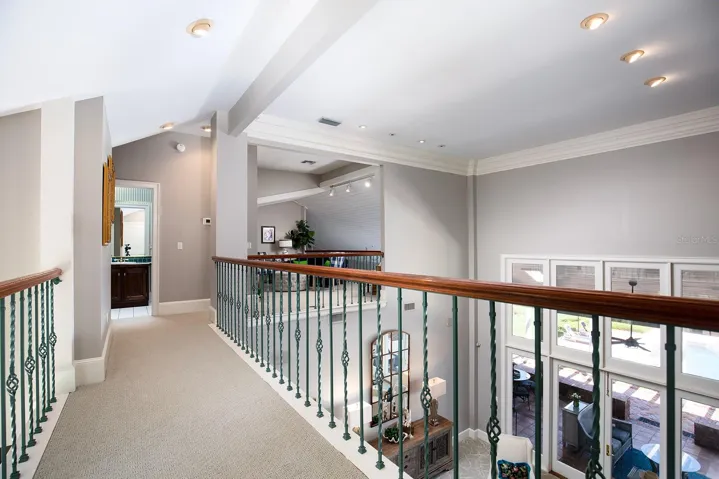 Walkway above the first floor that leads to the loft, additional bedroom and bathroom. Private get away space and yet you still feel like you are part of the main activities.