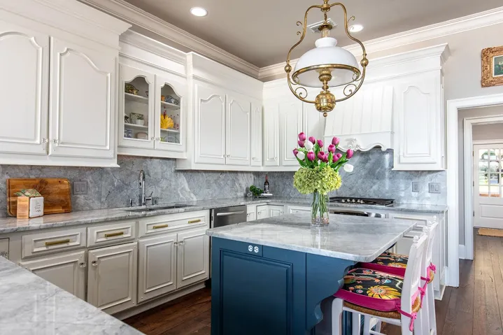 An abundance of cabinetry, storage, island, massive STAINLESS-STEEL appliances, GRANITE prep space & HIGH-END fixtures make this functional as well as impressive.