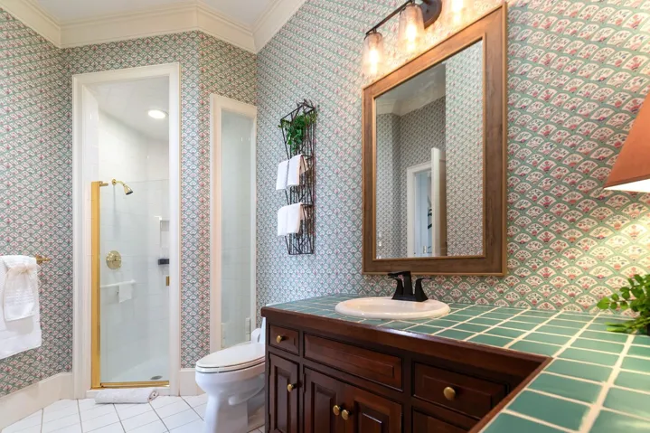 Another spacious bathroom right off a bedroom.