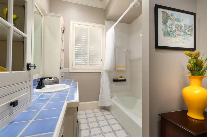 Downstairs bathroom right off the bedroom with the window seat. Such a functional split bedroom plan.
