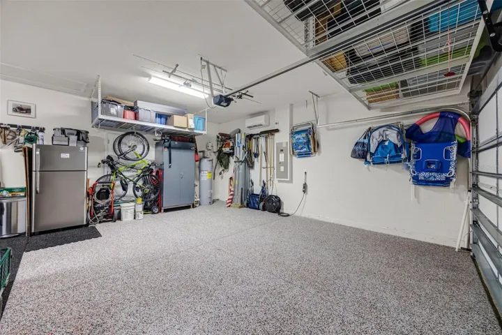 3 car garage with epoxy flooring and separate AC system