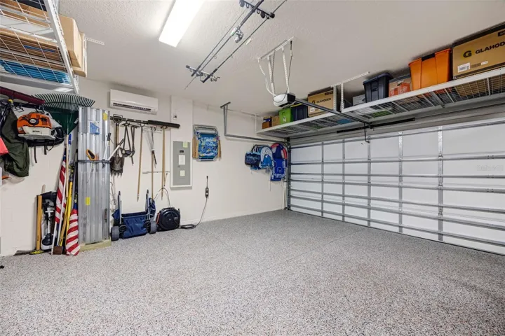 3 car garage with epoxy flooring and separate AC system