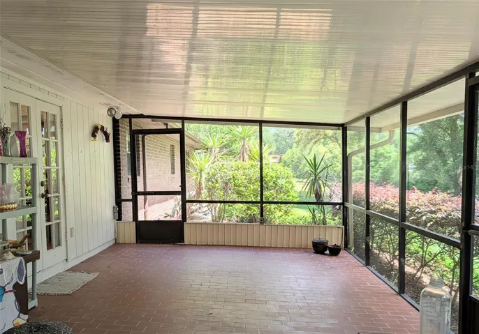 back sunroom with French door to dining room