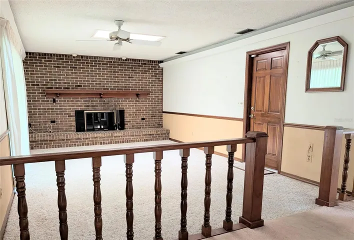 living room, door to the 2 car garage