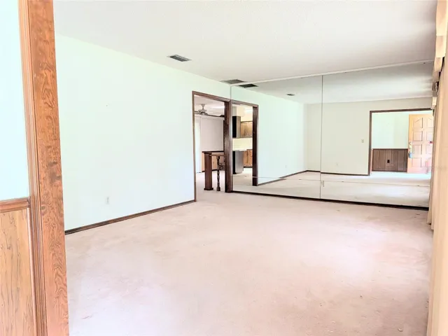 living room with wall mirrors