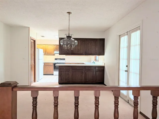 view from Family room to formal dining and kitchen