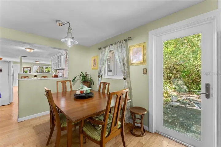 Dining area with impact glass door to patio