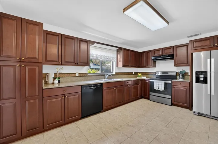 Open Kitchen with tons of storage, granite counters, stainless appliances, and updated cabinetry