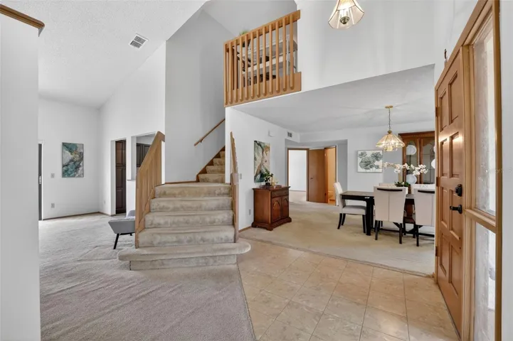 This terrific foyer welcomes you with vaulted ceilings and tons of natural light