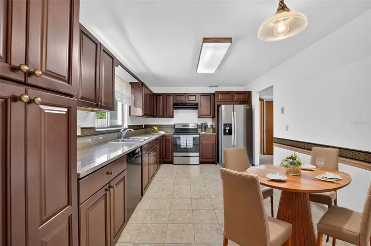 This kitchen also offers a breakfast nook and window over the sink