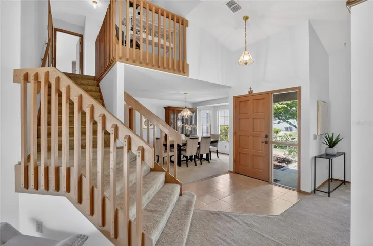 Beautiful staircase adorns the entryway and provides a wonderful focal point